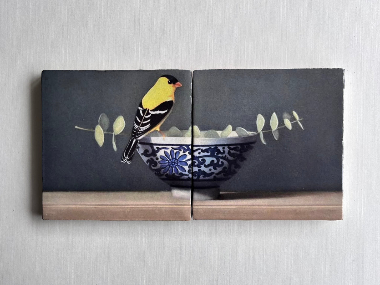 Tweeluik Vogel op kom met tak