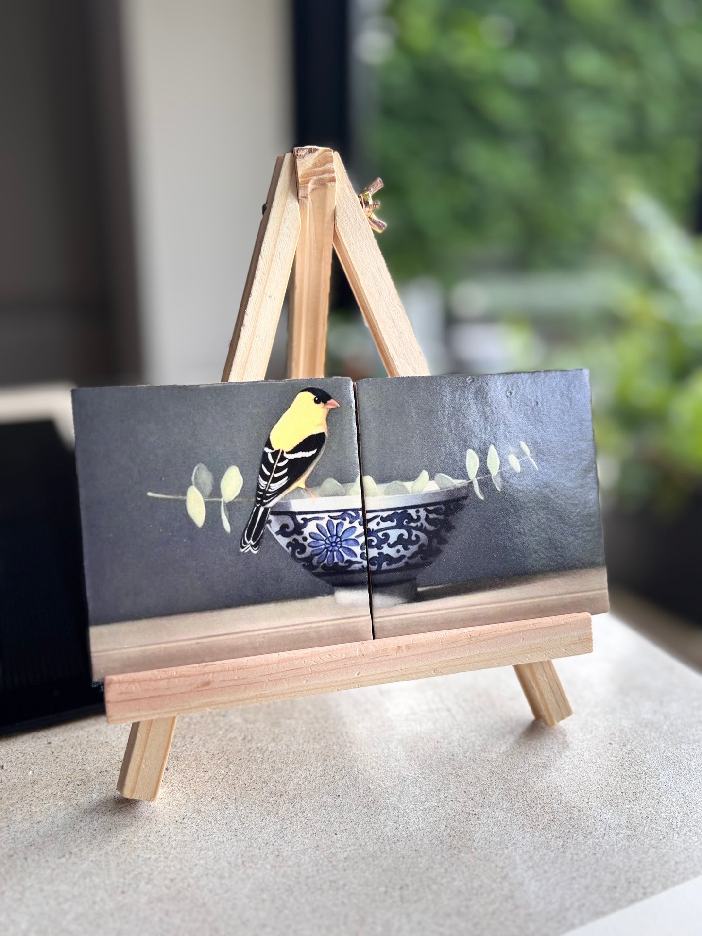 Tweeluik Vogel op kom met tak